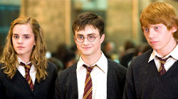 Hermoine, Harry, and Ron looking to the left. 